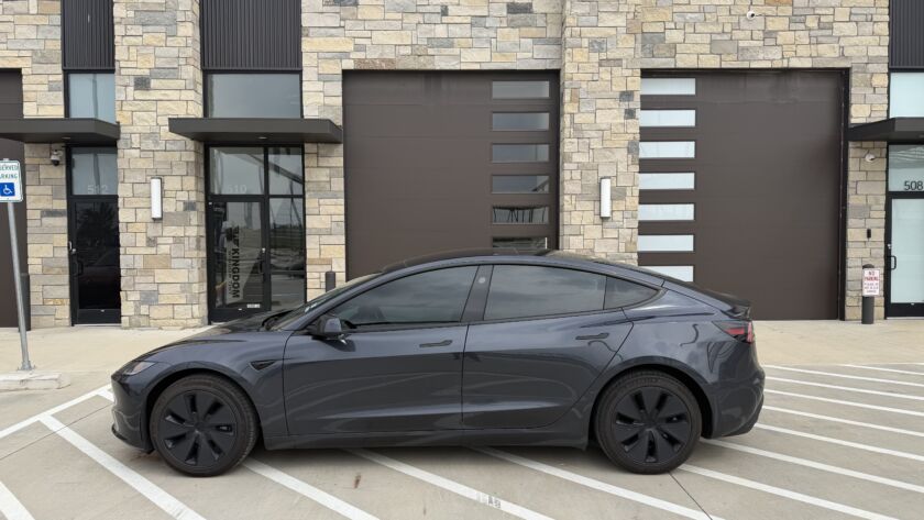 Tinted Tesla outside the Kingdom Window Tint shop in Lewisville, TX