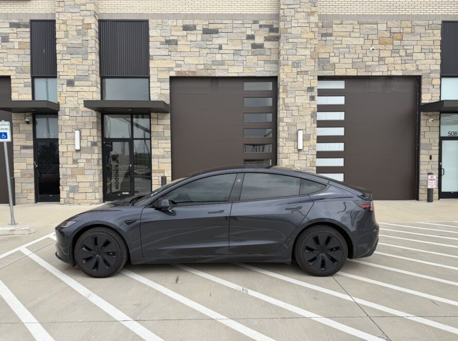 Tinted Tesla outside the Kingdom Window Tint shop in Lewisville, TX