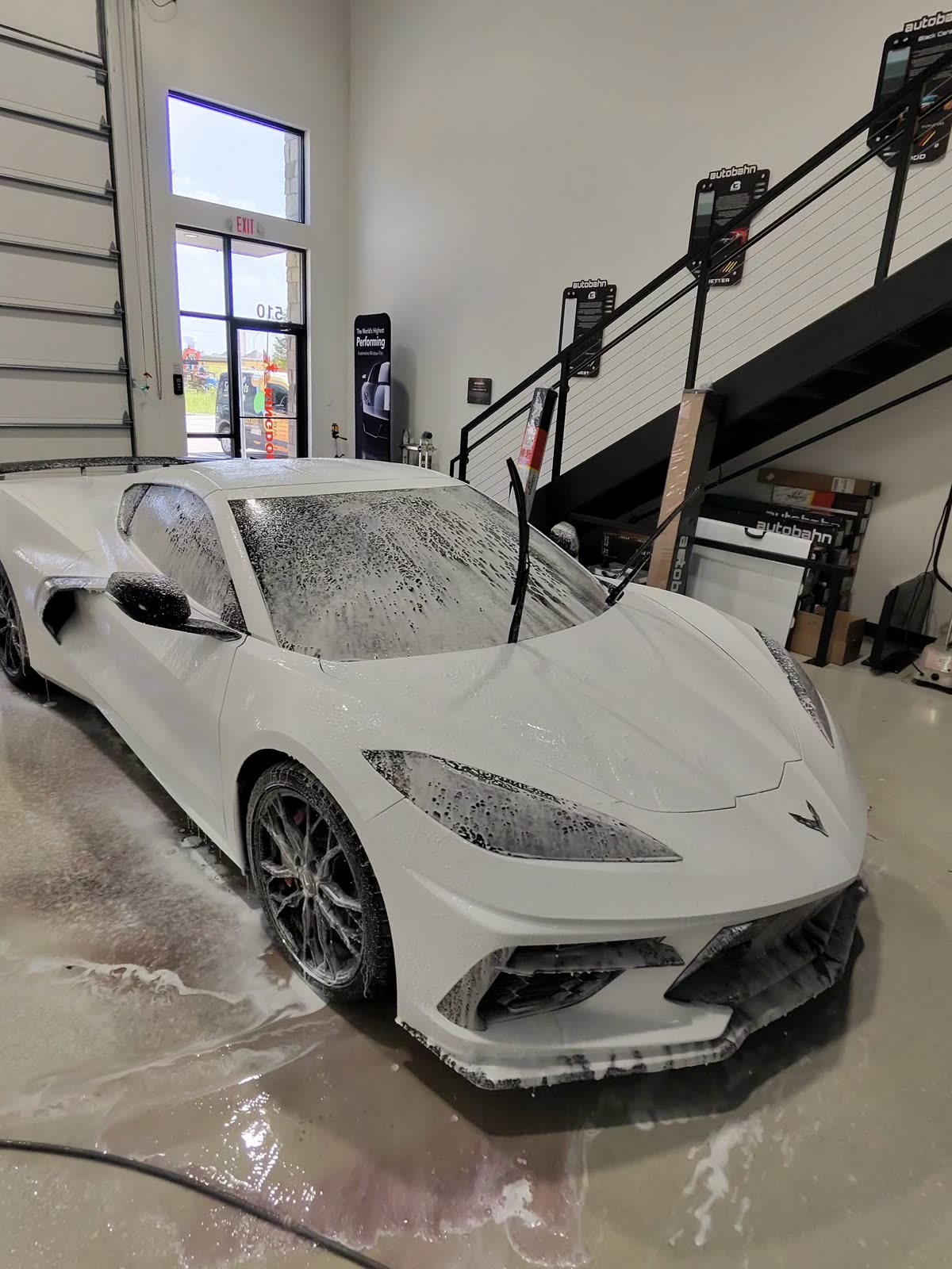 C8 Corvette covered in foam during the pre-wash before PPF and ceramic coating