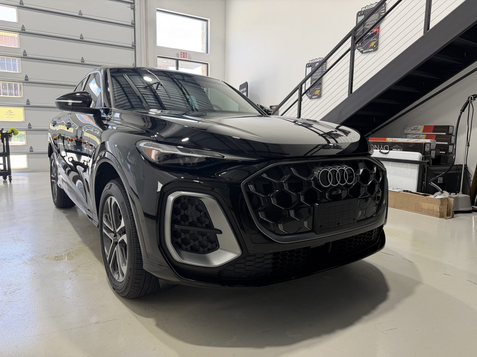 Grille and front bumper of a black Audi Q5 Sportback after swirl removal and ceramic coating