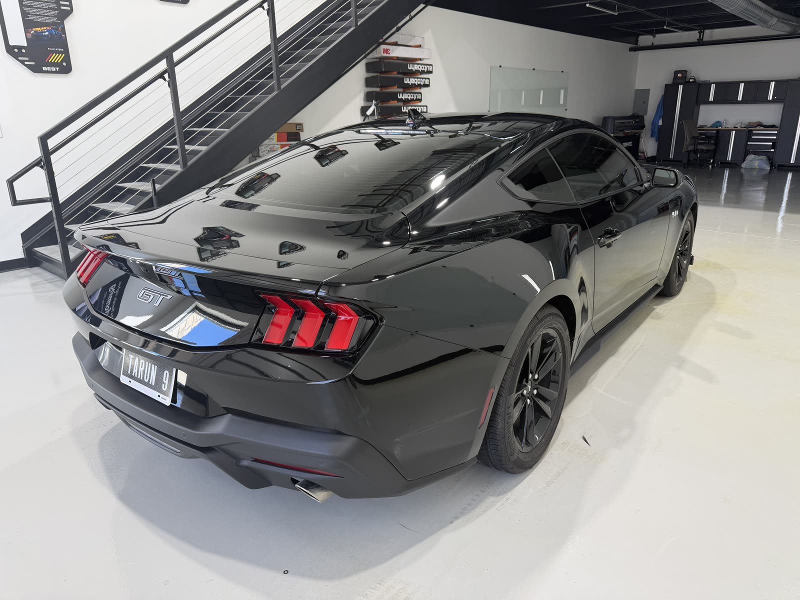 Rear of a black Ford Mustang GT with ceramic coating at our Lewisville shop