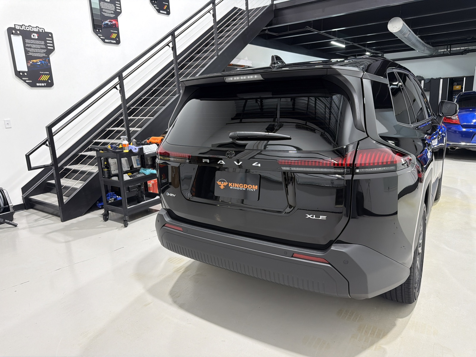 Rear of a black Toyota RAV4 XLE with ceramic coating and ceramic window tint