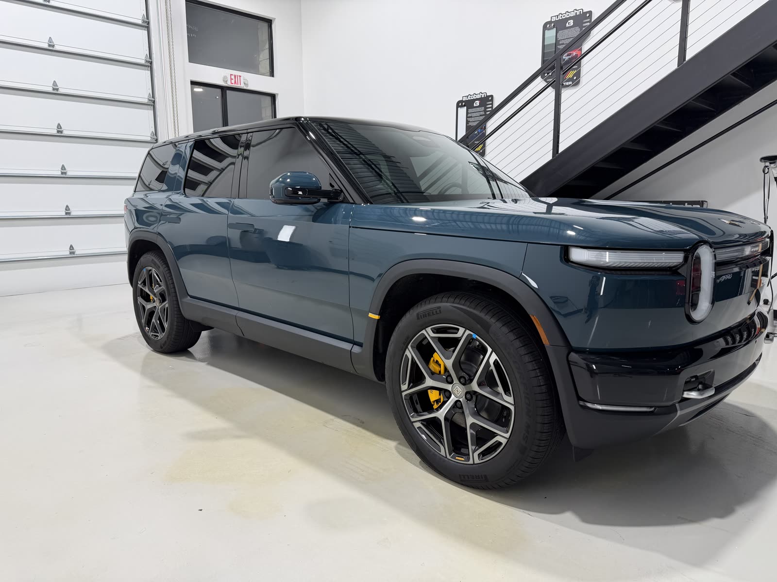 Side profile of a ceramic coated Rivian R1S with ceramic window tint in Lewisville